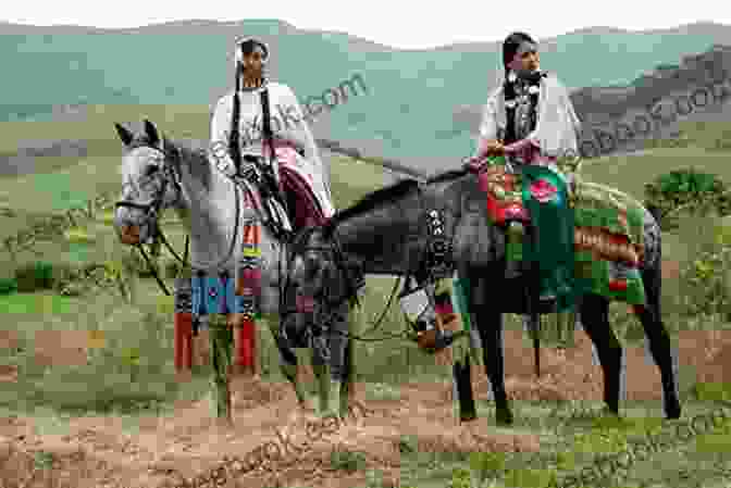 A Group Of Nez Perce People On Horseback, Riding Through A Valley. Dreamers: On The Trail Of The Nez Perce