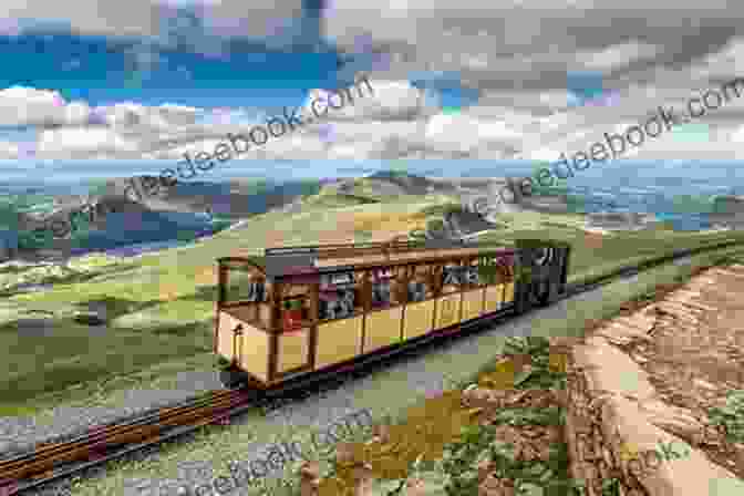 A Train Ascending Snowdon Mountain, With Stunning Views Of The Surrounding Landscape. Rebuilding The Welsh Highland Railway: Britain S Longest Heritage Line (Narrow Gauge Railways)