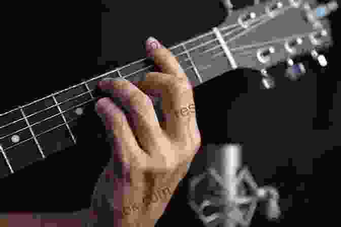Close Up Of A Guitarist's Hand Forming A Bar Chord Guitar Training Vol 5: E Form Bar Chord