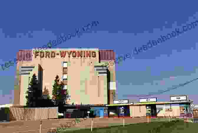 Exterior View Of The Ford Wyoming Drive In, Showcasing Its Iconic 60 Foot Neon Sign And Classic Carhop Service. The Ford Wyoming Drive In: Cars Candy Canoodling In The Motor City (Landmarks)
