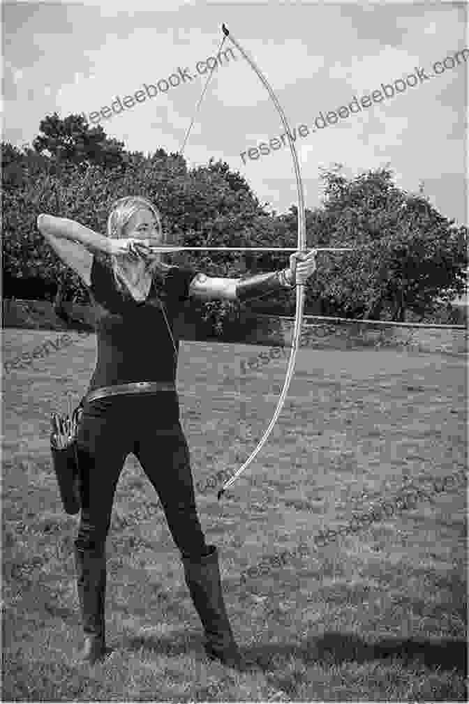 Linda Davies, The Renowned English Longbow Archer And Trailblazing Female Athlete, Stands With Her Bow And Arrow In Hand, Her Determined Gaze Fixed On The Target Longbow Girl Linda Davies