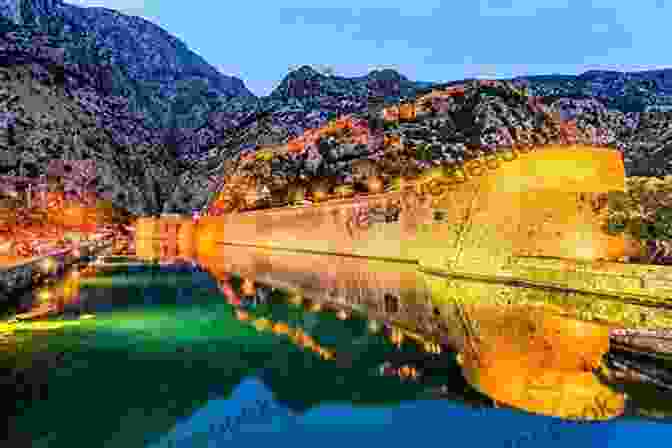 Panoramic View Of The Bay Of Kotor, A Stunning Fjord Like Inlet With Towering Mountains And Shimmering Waters. Postcards: A Visual Escape Through Montenegro